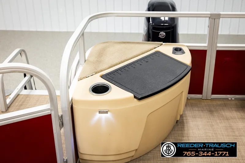 Slide: The Image of 2019 SUNTRACKER 20 DLX boat interior with storage compartment and measuring board. - 27