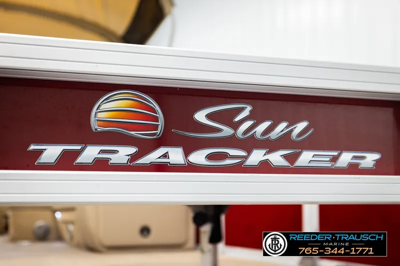 Slide: The Image of 2019 SUNTRACKER 20 DLX logo on a red background, featuring Reeder-Trausch Marine contact details. - 56