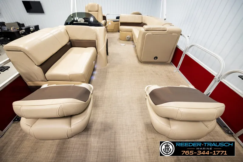 Slide: The Image of 2019 SUNTRACKER 20 DLX pontoon boat interior with beige seating and carpet flooring. - 21