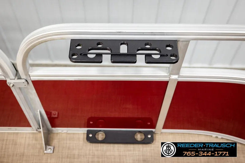 Slide: The Image of 2019 SUNTRACKER 20 DLX boat railing with mounted accessory bracket. - 47
