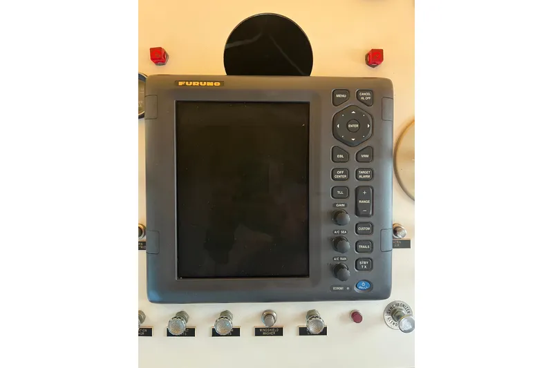 Slide: The Image of Furuno marine navigation system on 1982 Pluckebaum Coastal Cruiser control panel. - 46
