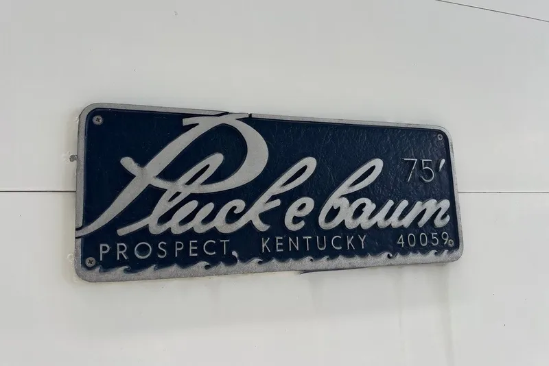 Slide: The Image of Plaque displaying "Pluckebaum" with location "Prospect, Kentucky" and number "75'". - 2
