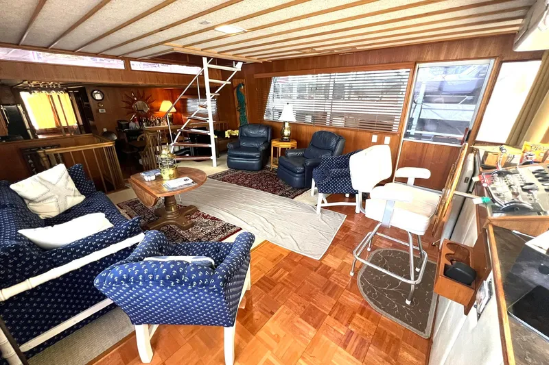 Slide: The Image of Interior of 1982 Pluckebaum Coastal Cruiser with cozy seating and nautical decor. - 12
