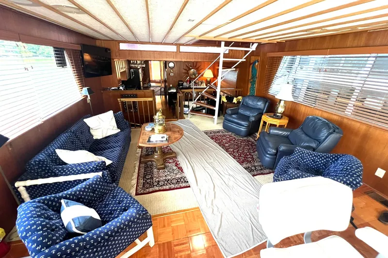 Slide: The Image of Interior of 1982 Pluckebaum Coastal Cruiser with cozy seating and nautical decor. - 11