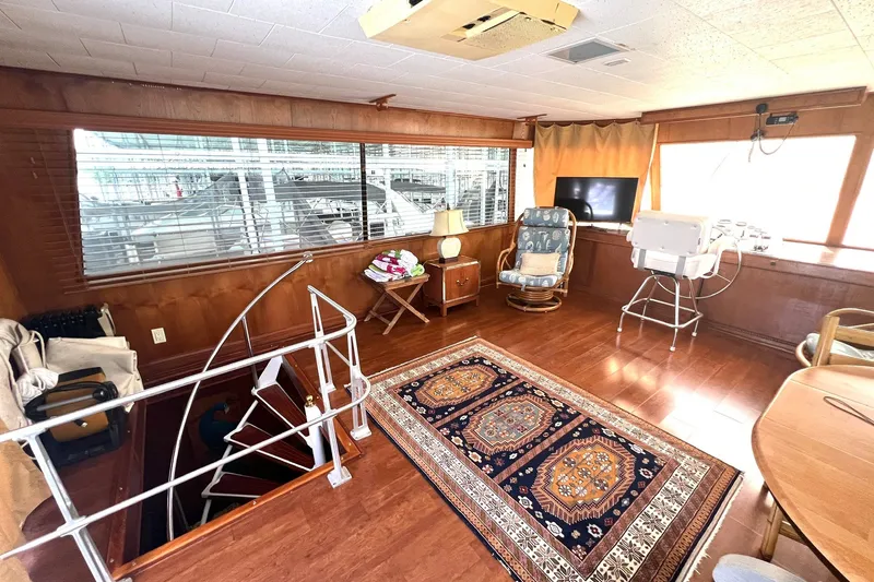 Slide: The Image of Interior of 1982 Pluckebaum Coastal Cruiser with wooden decor and patterned rug. - 41