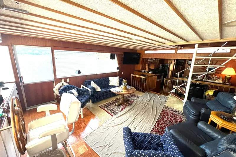 Slide: The Image of Interior of 1982 Pluckebaum Coastal Cruiser with cozy seating and nautical decor. - 10