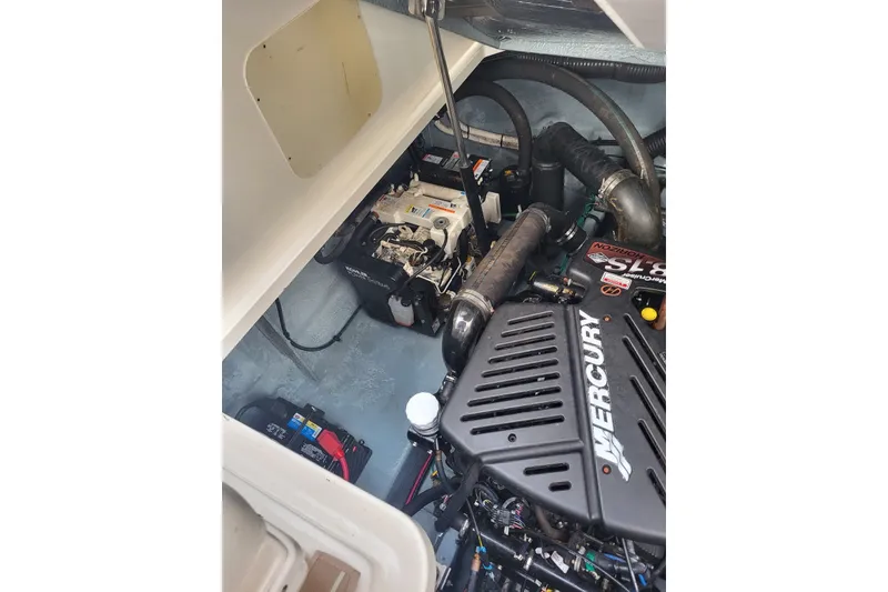 Slide: The Image of Engine compartment of 2004 Sea Ray 340 Sundancer with Mercury components visible. - 40