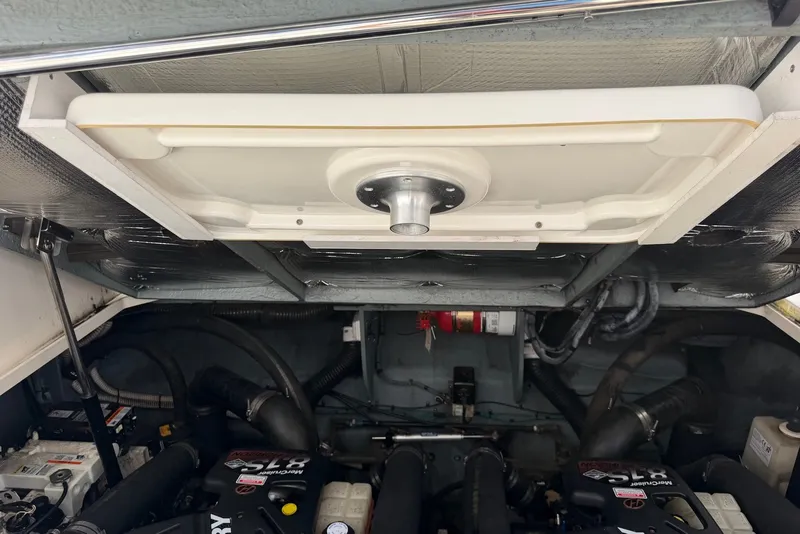 Slide: The Image of Engine compartment of a 2004 Sea Ray 340 Sundancer boat, showcasing mechanical components. - 36