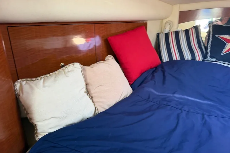 Slide: The Image of Cozy cabin interior of 2004 Sea Ray 340 Sundancer with colorful pillows and bedding. - 31