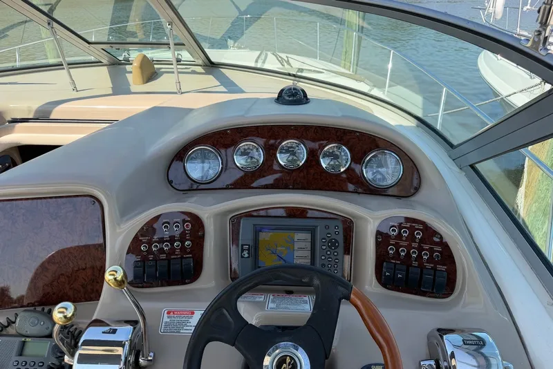 Slide: The Image of Helm of 2004 Sea Ray 340 Sundancer with gauges and navigation system. - 8