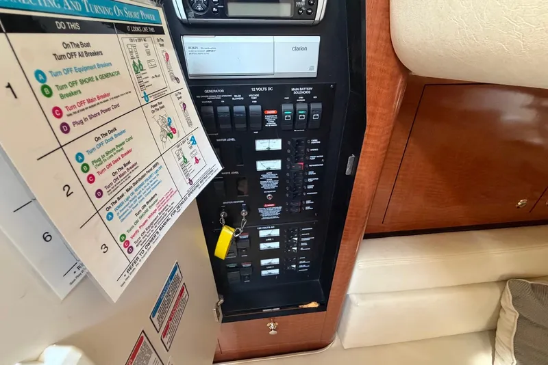 Slide: The Image of Electrical panel of a 2004 Sea Ray 340 Sundancer boat with instructions. - 35