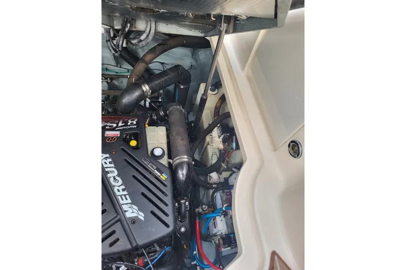 Slide: The Image of Engine compartment of a 2004 Sea Ray 340 Sundancer with Mercury components. - 39