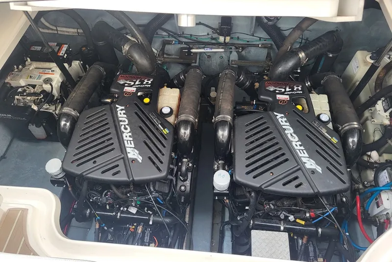 Slide: The Image of Engine compartment of a 2004 Sea Ray 340 Sundancer with twin Mercury engines. - 37