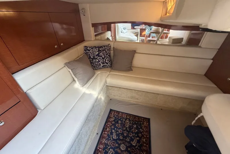 Slide: The Image of Luxurious interior of 2004 Sea Ray 340 Sundancer with plush seating and elegant decor. - 23