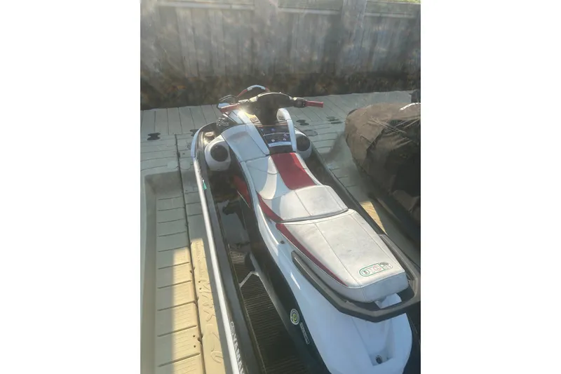 Slide: The Image of 2021 Yamaha WaveRunner VX Deluxe on dock, white and red design. - 7