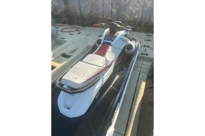 Slide: The Image of 2021 Yamaha WaveRunner VX Deluxe on dock, white and red design. - 8