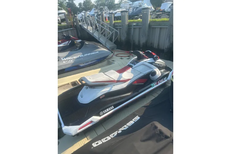 Slide: The Image of 2021 Yamaha WaveRunner VX Deluxe jet ski docked at marina. - 4