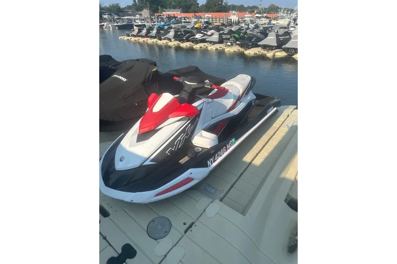Slide: The Image of 2021 Yamaha WaveRunner VX Deluxe jet ski docked at marina. - 3