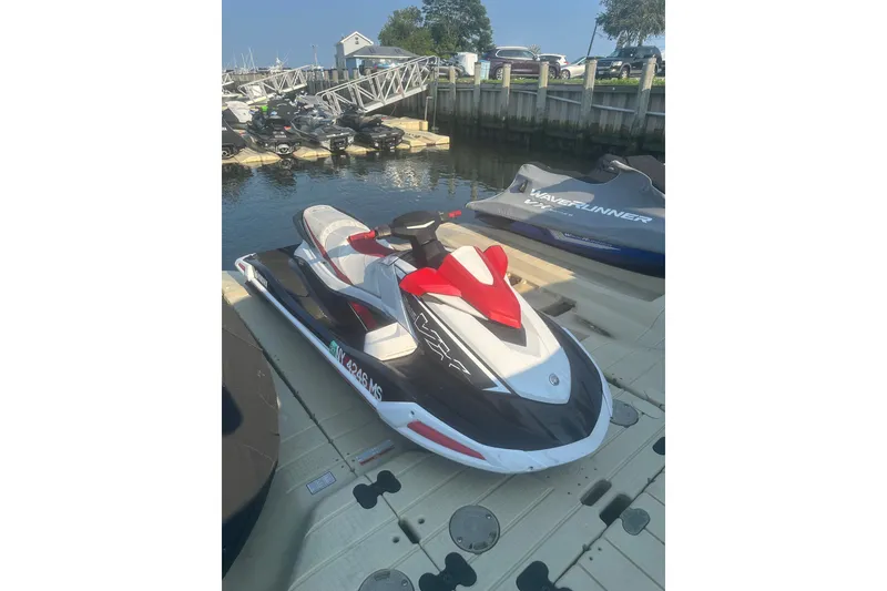 The Image of 2021 Yamaha WaveRunner VX Deluxe jet ski docked by the water. - 1