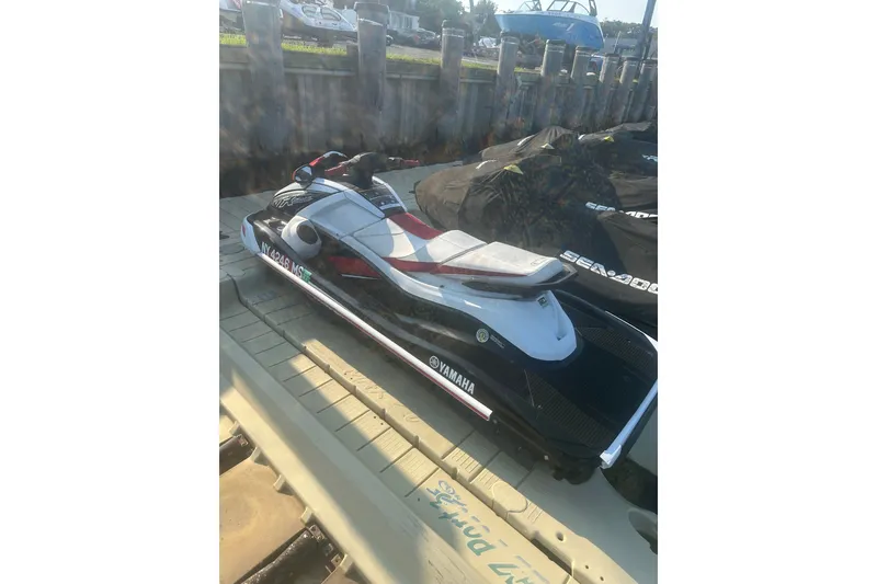 Slide: The Image of 2021 Yamaha WaveRunner VX Deluxe jet ski docked on a sunny day. - 6