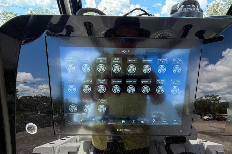 Slide: The Image of Touchscreen control panel on 2023 Sportsman Heritage 261 Center Console boat, displaying various system options. - 28
