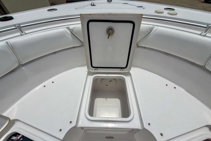 Slide: The Image of 2023 Sportsman Heritage 261 Center Console boat with open storage compartment. - 45
