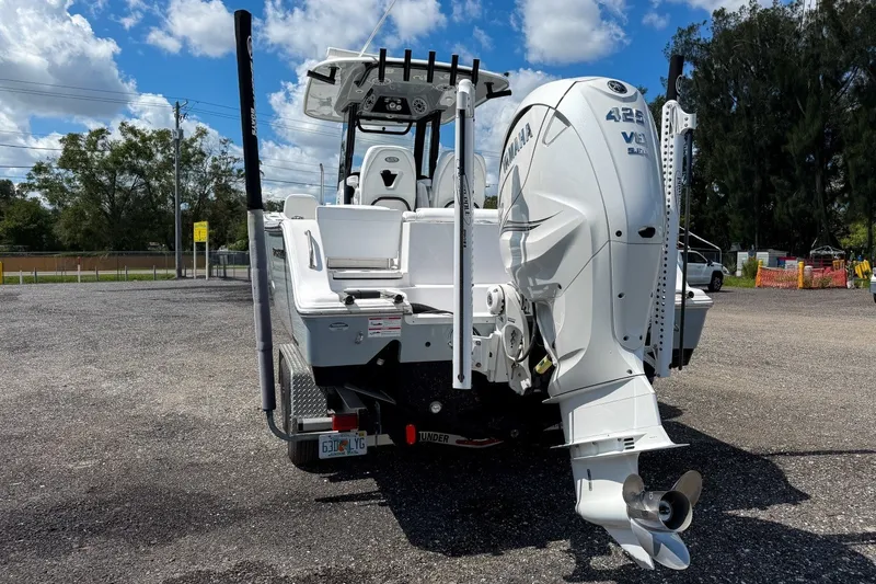 Slide: The Image of 2023 Sportsman Heritage 261 Center Console boat with Yamaha 425 V8 engine, parked outdoors. - 16
