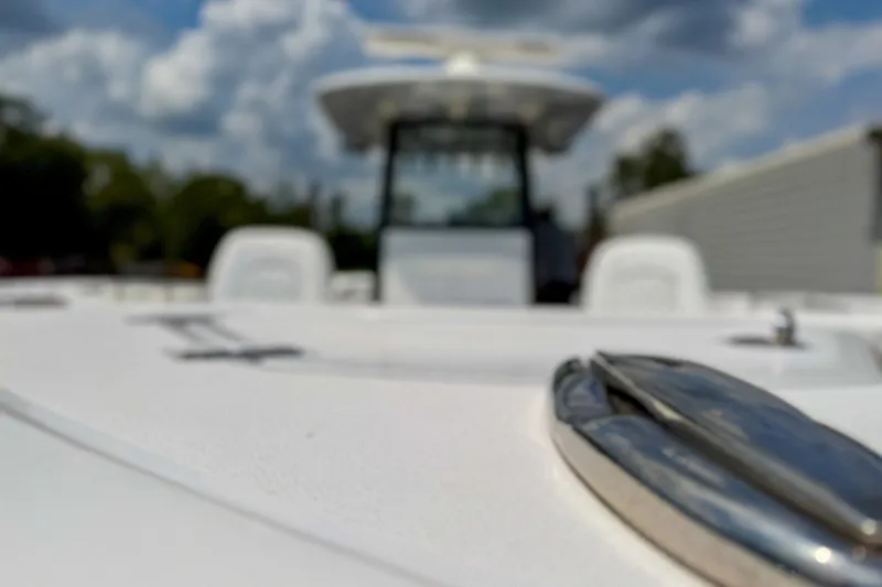Slide: The Image of 2023 Sportsman Heritage 261 Center Console boat, blurred focus, sunny day, sleek design. - 72