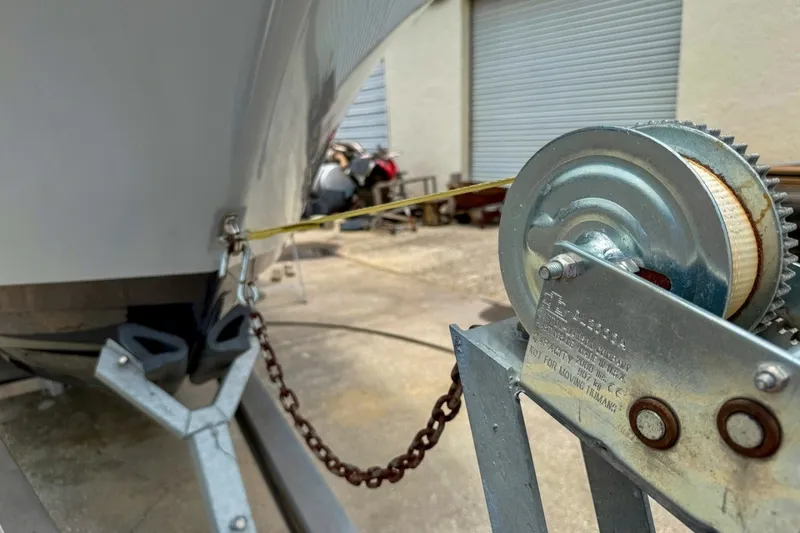 Slide: The Image of Close-up of 2023 Sportsman Heritage 261 Center Console boat on trailer with winch. - 82