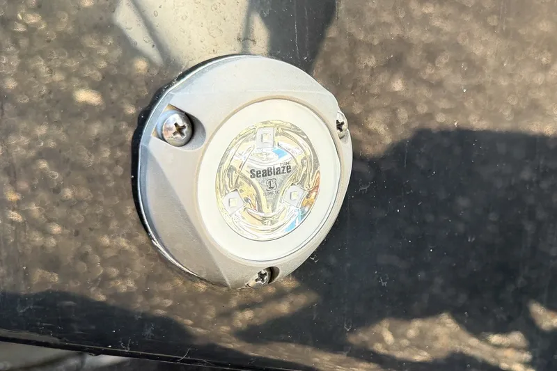 Slide: The Image of Close-up of SeaBlaze light on 2023 Sportsman Heritage 261 Center Console boat. - 60