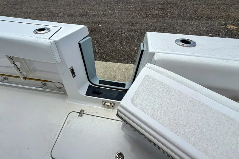 Slide: The Image of 2023 Sportsman Heritage 261 Center Console boat interior with seating and storage compartments. - 49