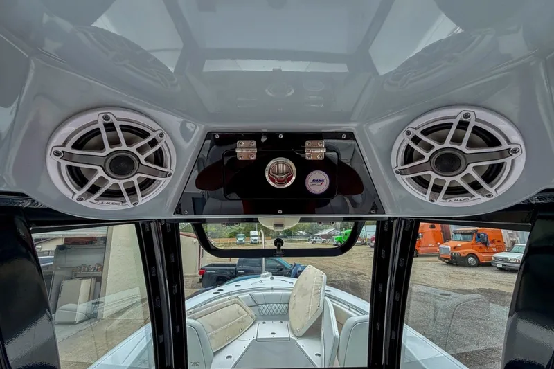 Slide: The Image of 2023 Sportsman Heritage 261 Center Console with JL Audio speakers and helm view. - 33