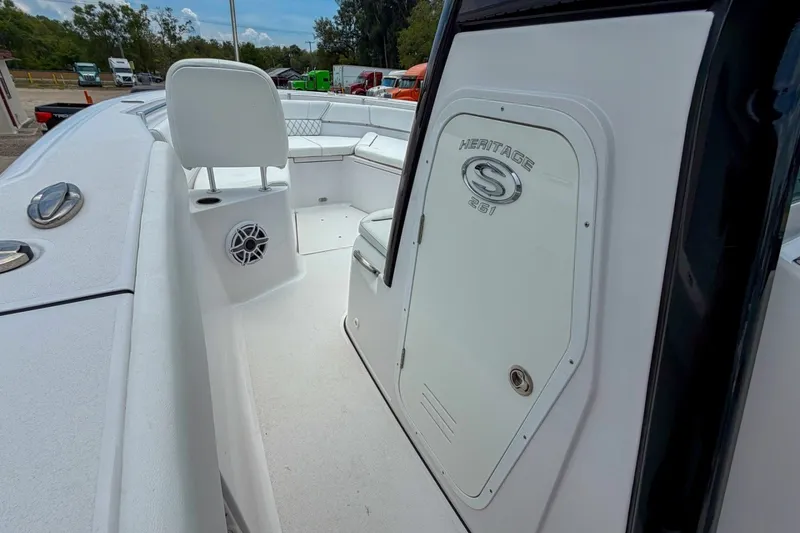 Slide: The Image of 2023 Sportsman Heritage 261 Center Console boat interior with seating and storage. - 52