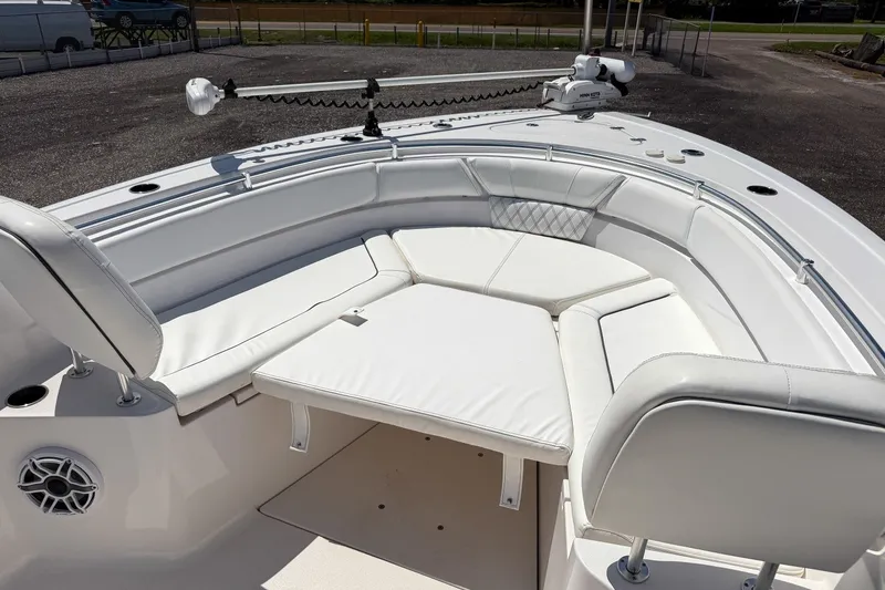 Slide: The Image of 2023 Sportsman Heritage 261 Center Console boat with white cushioned seating area. - 38
