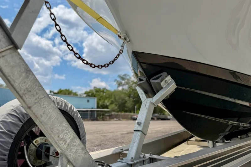 Slide: The Image of 2023 Sportsman Heritage 261 Center Console on trailer, under a clear blue sky. - 85