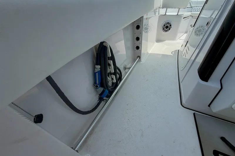 Slide: The Image of 2023 Sportsman Heritage 261 Center Console interior with storage and safety equipment. - 48