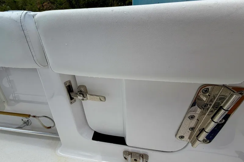 Slide: The Image of 2023 Sportsman Heritage 261 Center Console boat seat and latch detail. - 51