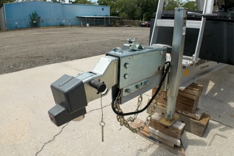 Slide: The Image of Trailer hitch of 2023 Sportsman Heritage 261 Center Console on wooden blocks. - 86