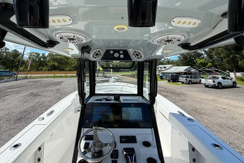 Slide: The Image of 2023 Sportsman Heritage 261 Center Console boat interior with advanced navigation system. - 21