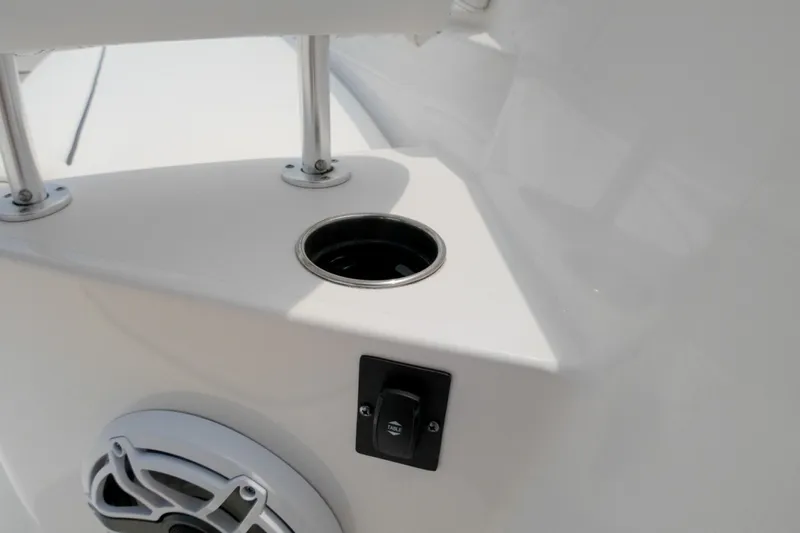 Slide: The Image of Cup holder and speaker on 2023 Sportsman Heritage 261 Center Console boat. - 47