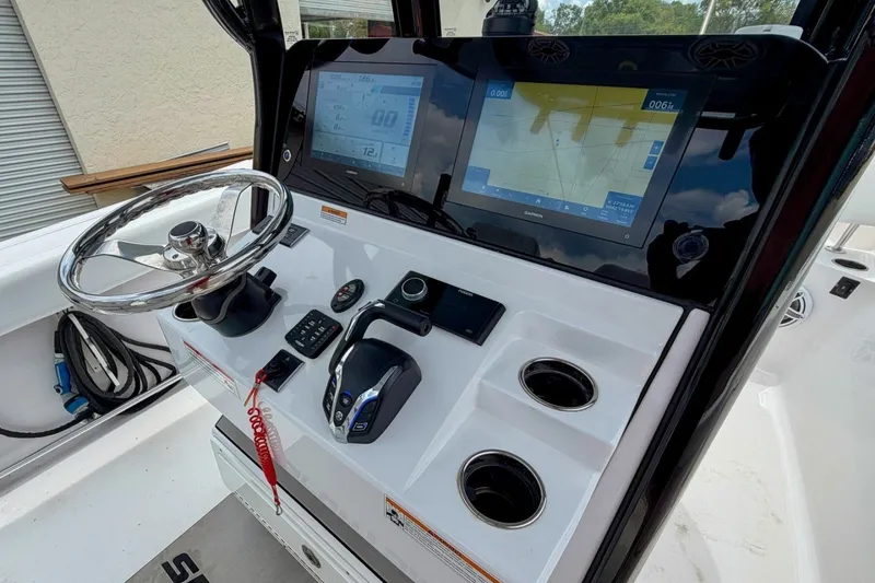 Slide: The Image of 2023 Sportsman Heritage 261 Center Console dashboard with steering wheel and navigation display. - 29