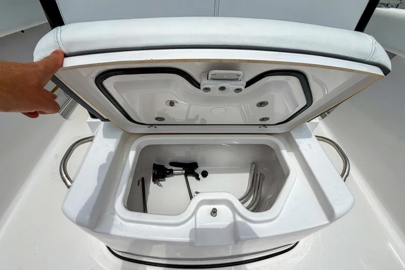 Slide: The Image of Open storage compartment on 2023 Sportsman Heritage 261 Center Console boat. - 37