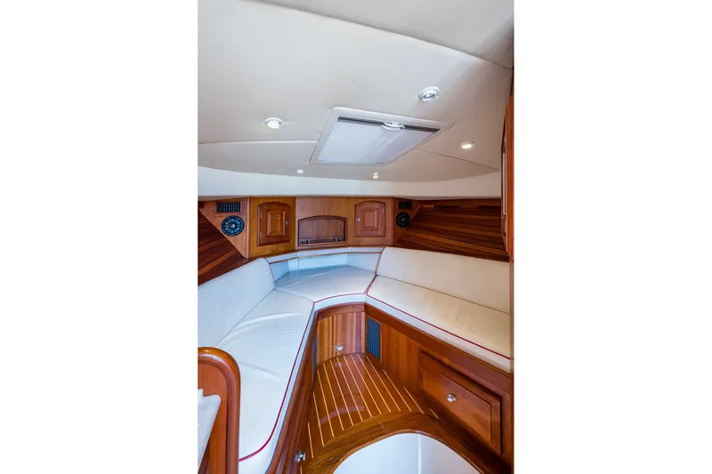 Slide: The Image of Interior of 2008 Hinckley Talaria 38R Convertible with elegant wood and white seating. - 14