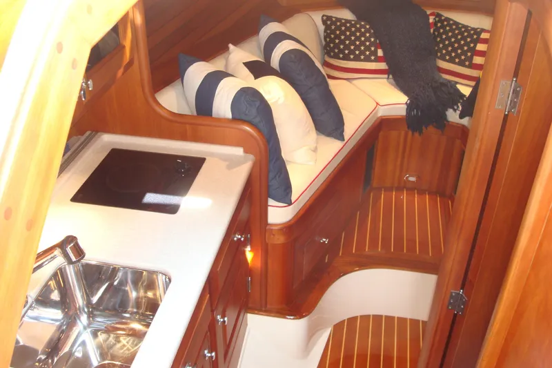 Slide: The Image of Luxurious interior of 2008 Hinckley Talaria 38R Convertible with cozy seating and elegant wood finish. - 6