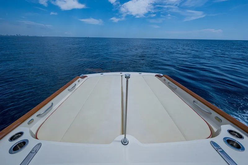 Slide: The Image of Hinckley Talaria 38R Convertible 2008 boat deck overlooking the ocean under a clear blue sky. - 6