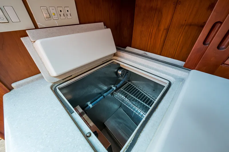 Slide: The Image of Interior view of a 2008 Hinckley Talaria 38R Convertible yacht's built-in cooler. - 12