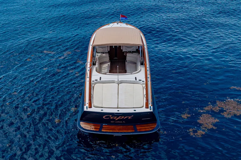 Slide: The Image of 2008 Hinckley Talaria 38R Convertible yacht on blue ocean waters. - 5