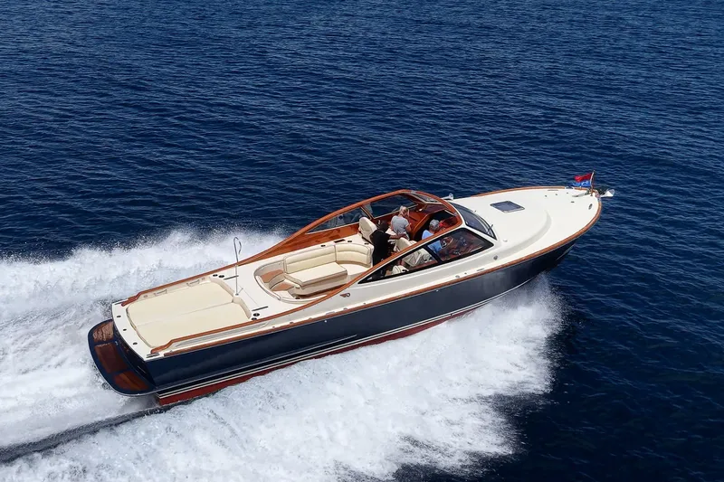 The Image of 2008 Hinckley Talaria 38R Convertible cruising on open water, showcasing elegant design. - 1