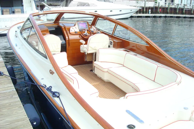 Slide: The Image of 2008 Hinckley Talaria 38R Convertible yacht with elegant seating and polished wood finish. - 1