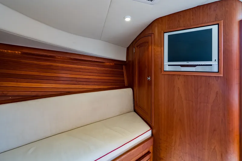Slide: The Image of Interior of 2008 Hinckley Talaria 38R Convertible with wood paneling and built-in TV. - 13